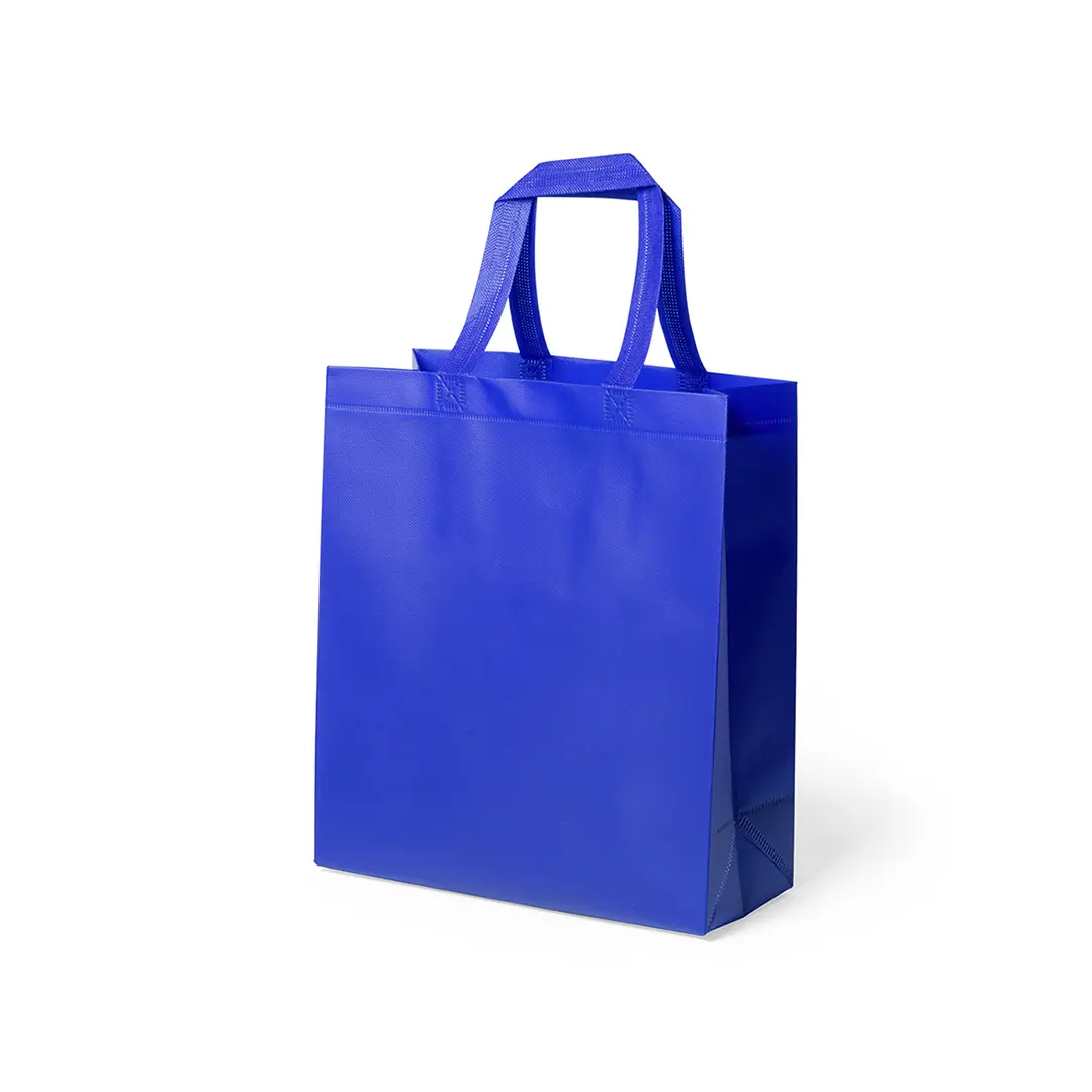 bolsa reutilizable azul de tejido no tejido con dos asas cortas sobre fondo blanco